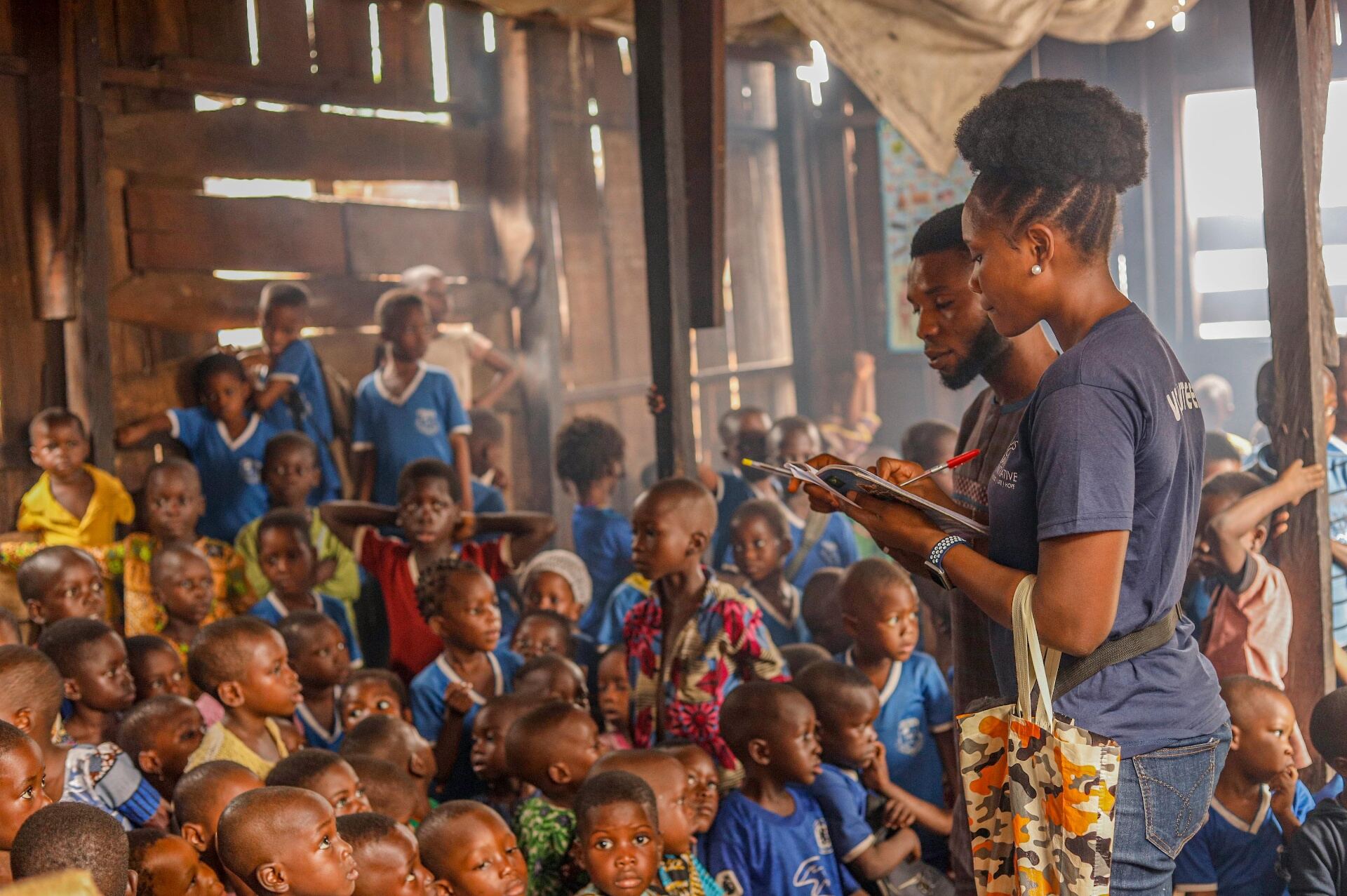 Foundation team registering children at a community school in Lagos